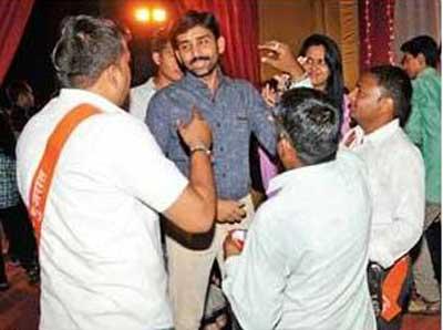 bajrang-dal-activists-purify-non-hindus-at-garba-venues-in-gandhinagar-by-sprinkling-cow
