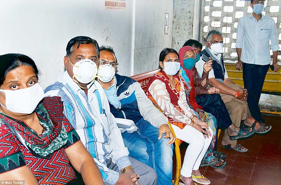 Patients queue up outside the swine flu isolation ward at Civil Hospital in Ahmedabad